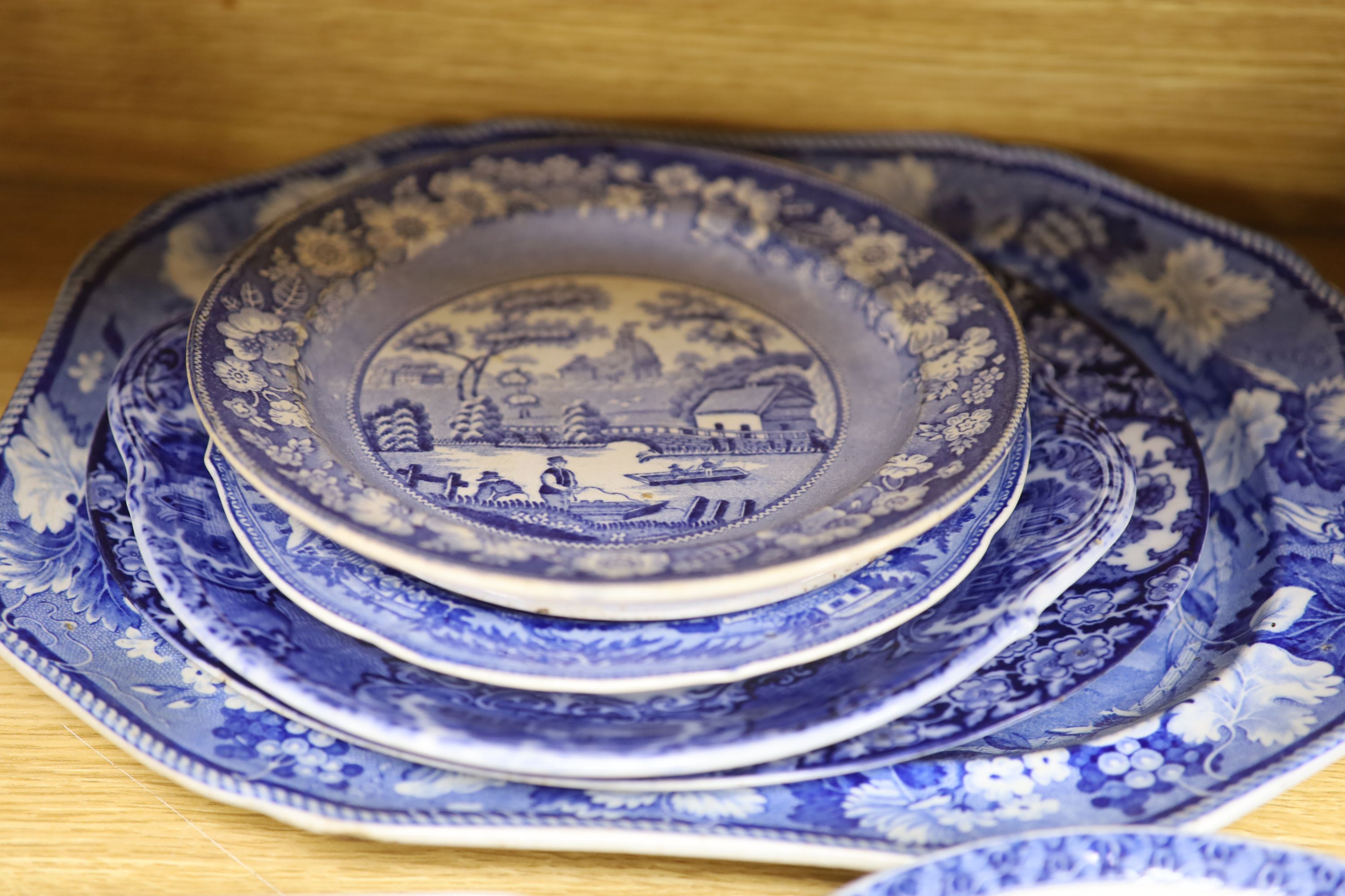 A quantity of 19th century blue and white pottery, including a Harewood House platter, 37cm, and a Spode Rome Tiber soup plate